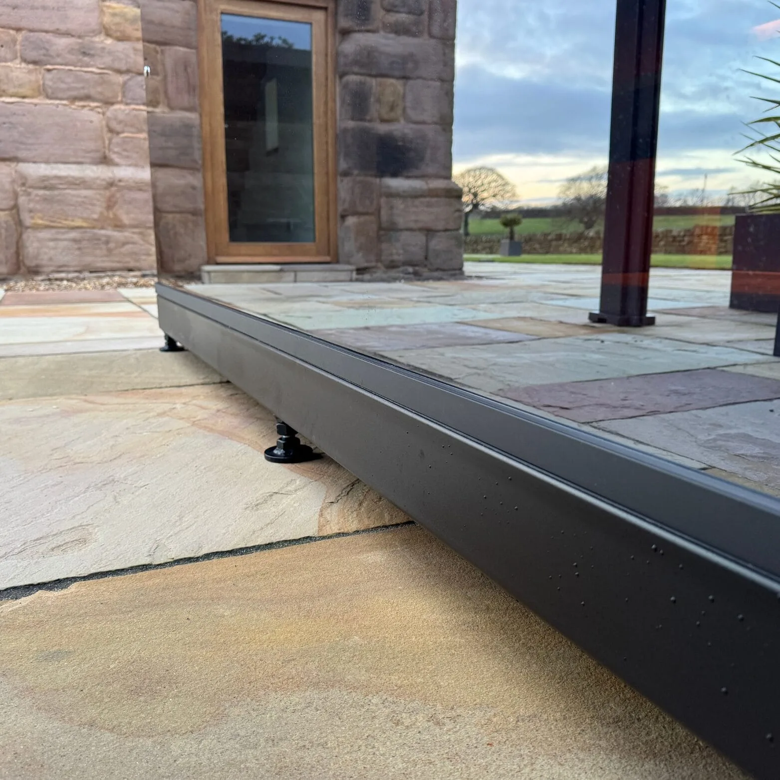 Outdoor sauna with galvanised steel base and adjustable heavy duty legs.
